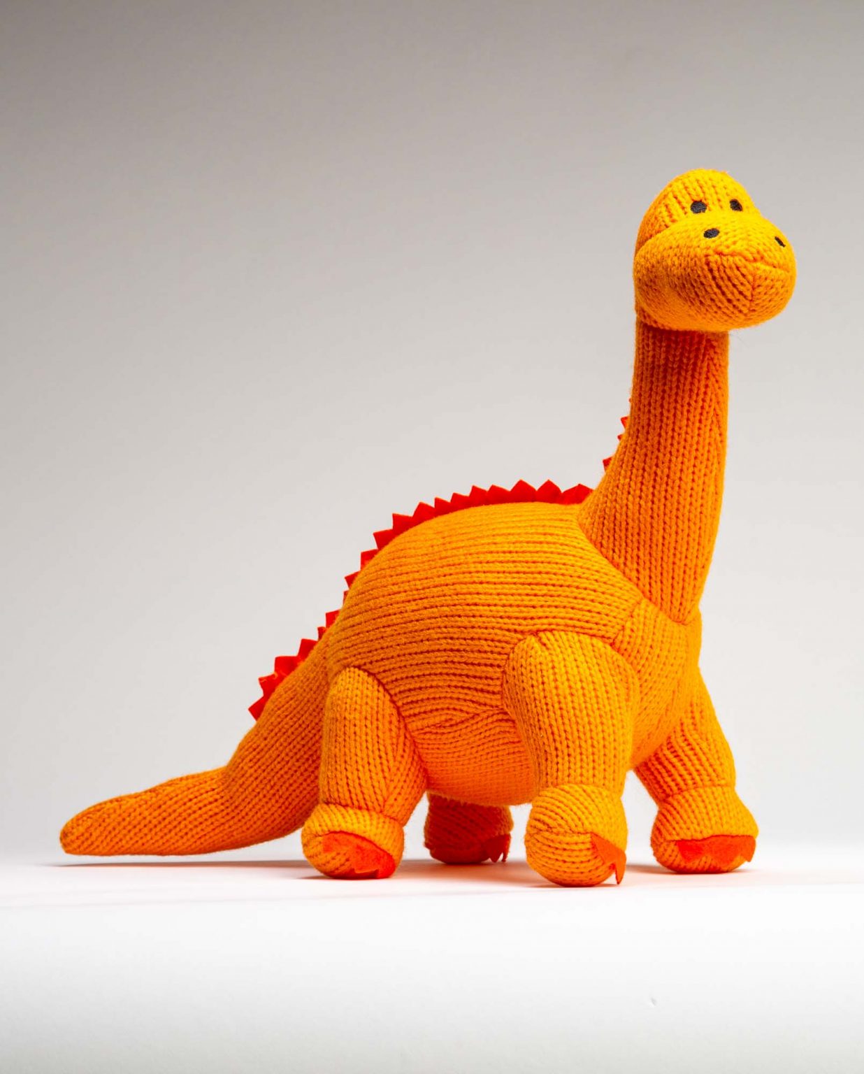 Orange Knitted Diplodocus Soft Toy - Send a Cuddly