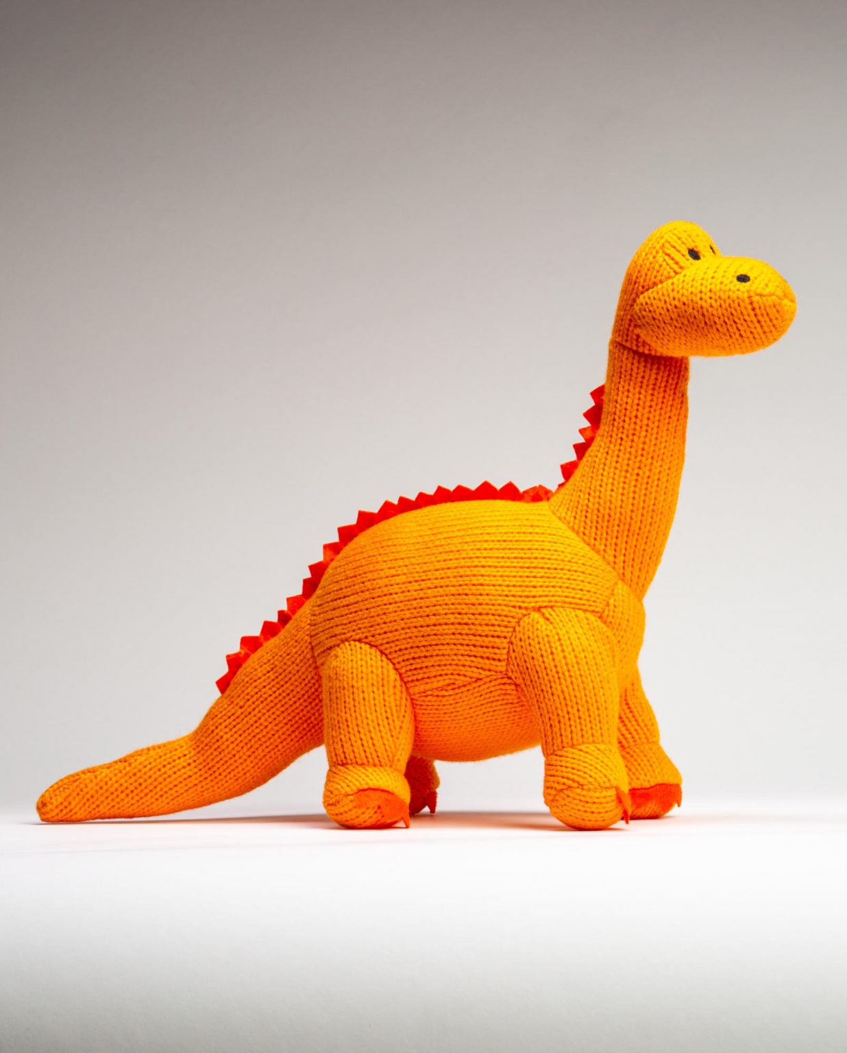 Orange Knitted Diplodocus Soft Toy - Send a Cuddly